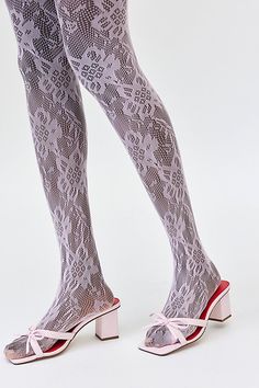 Sheer lace tights with an allover floral pattern for a femme finish. Features Ella lace tights Sheer tights Allover lace pattern Comfy waistband Content + Care 92% Nylon, 8% spandex Hand wash Imported Size + Fit S/M 4'10" -5'6" 90-130lbs L/XL 5'7" -5'6" 130-200lbs | Ella Lace Tights in Pink, Women's at Urban Outfitters Feminine Stretch Tights For Spring, Spring Fitted Lace Hosiery, Spring Lace Legwear With Stretch, Spring Party Lace Hosiery, Feminine Spring Stretch Tights, Spring Stretch Lace Legwear, Spring Lace Stretch Legwear, Sheer Lace Stretch Tights, Lace Trim Hosiery