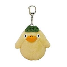 a stuffed animal keychain with a green hat on it's head and eyes