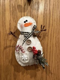 a snowman made out of paper and buttons