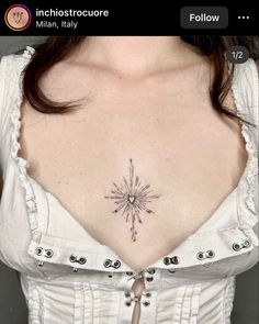 the back of a woman's chest with a star tattoo on it