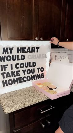 a woman holding up a sign that says, my heart would crumble if i could take you to home coming