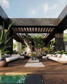 an outdoor living area with couches and plants