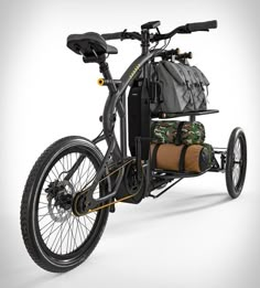 a bike with two bags strapped to the back and seat on it's front wheel