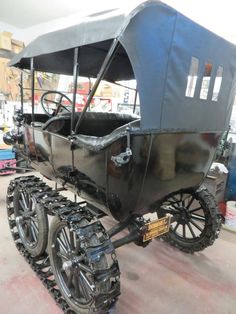 an old fashioned buggy is being worked on