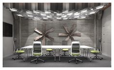 a conference room with four chairs and a table in front of a wall mounted ceiling fan