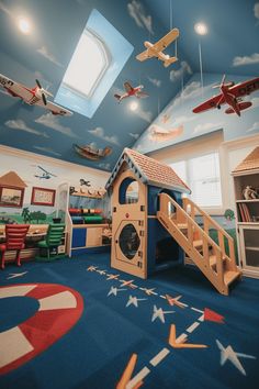 a child's playroom with toys and decorations on the walls, painted in blue