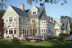 a large green house sitting on top of a lush green field