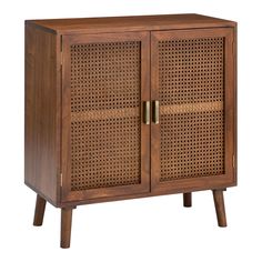 a wooden cabinet with wicker doors and legs