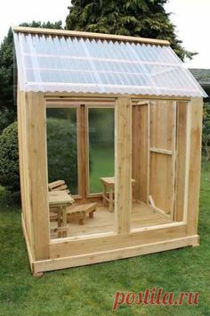 a small wooden house with a glass roof