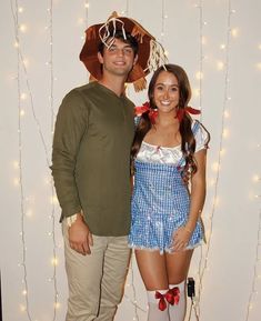 a man and woman dressed up in costumes