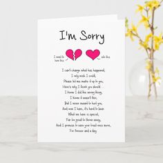 a card that says i'm sorry with two hearts on it and daisies in the background