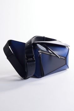 UNLEASH YOUR STYLE WITH THE GEOMETRIC ELEGANCE of the Loewe Puzzle Bag in stunning navy blue. Shop the latest from Loewe and other top designers at @italist and bring home the latest trends from the world's fashion capitals. Tap the link to shop. . . . #italist #italistsale #italistdoesitbetter #Loewe #PuzzleBag #LuxuryFashion Loewe Bags, Loewe Puzzle, Loewe Bag, Current Fashion, Top Designers