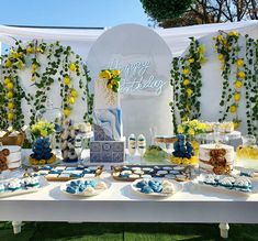 a table topped with lots of cakes and desserts