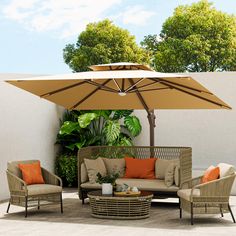 an outdoor patio with furniture and umbrella