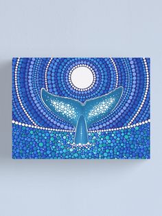 a painting of a blue whale swimming in the ocean with circles around it canvas print