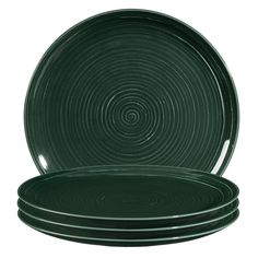 green dinner plates stacked on top of each other in front of a white background,