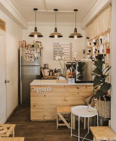 a small coffee shop with wooden tables and stools