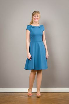 "Simple elegance! Our case dress Zoe is now also available with a swinging plate skirt. A fabulous dress made of fine romance jersey in lavendle blue, with small puff sleeves. The fine knocked over collar is particularly elegant. Malva conjures up a great silhouette and accompanies you elegantly yet comfortably through the day. The waist can be emphasized very nicely with a narrow belt. (not included) \"Malva\" comes in many colors. Please look at the Romitjersey colour table. The dress is avail Fitted Dress With Gathered Neckline In Solid Color, Fitted Solid Dress With Gathered Neckline, Elegant Light Blue Stretch Dress, Elegant Solid Dress With Gathered Neckline, Fitted Blue Dress With Gathered Neckline, Blue Fitted A-line Dress, Blue A-line Fitted Dress, Fitted Blue A-line Dress, Classic Blue A-line Dress