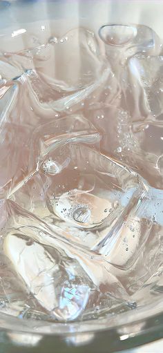 a glass bowl filled with ice and water