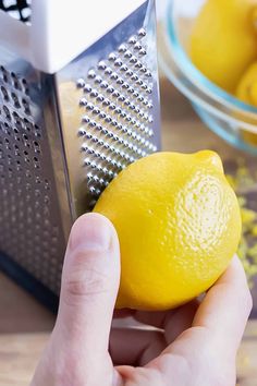 a person is grating lemons with a grater