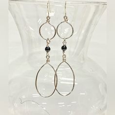 Elevate Your Style With These Exquisite Handmade Dangle Statement Earrings. Handcrafted With Silver Tone Tarnish-Resistant Jewelry Wire And Adorned With Genuine Hematite Beads, They Exude Elegance And Sophistication. Suspended From Sterling Silver French Hook Ear Wires, They Offer Both Style And Comfort. Hematite, Known For Its Healing Properties And Ability To Ward Off Negative Energies, Adds A Unique Touch. Associated With The Root Chakra, These Earrings Promote Grounding, Security, And Safety Silver Wire Wrapped Linear Earrings For Gift, Silver Wire Wrapped Linear Earrings As Gift, Modern Silver Teardrop Chandelier Earrings, Silver Wire-wrapped Sterling Silver Linear Earrings, Silver Wire-wrapped Dangle Linear Earrings, Silver Wire Wrapped Linear Earrings In Sterling Silver, Silver Metal Teardrop Earrings Wire Wrapped, Silver Wire Wrapped Dangle Linear Earrings, Silver Metal Wire Wrapped Teardrop Earrings