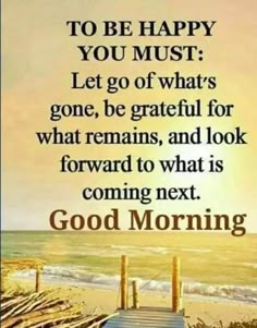 a quote on the beach saying to be happy you must let go of what's gone, be grateful for what remains and look forward to what is coming next