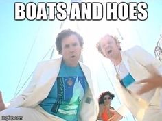 two men in white suits are dancing on a boat