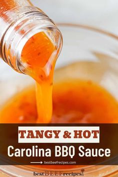 a glass bowl filled with orange bbq sauce being poured into the bowl and topped with an orange carrot