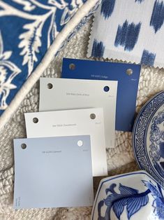 blue and white plates with tags on them