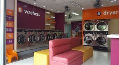 a washer and dryer shop with colorful furniture