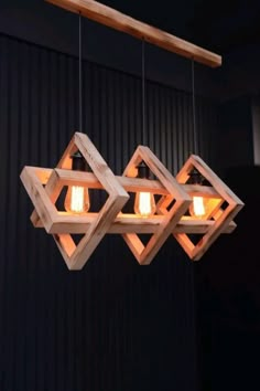 three wooden lights hanging from the ceiling