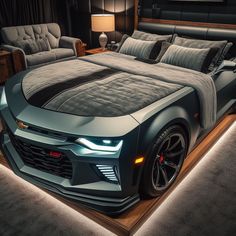 a car bed is lit up in the middle of a room with two couches