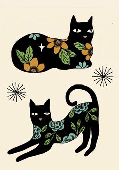 two black cats with floral designs on them