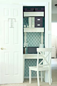 a white desk and chair in front of a bookcase with books on it's shelves