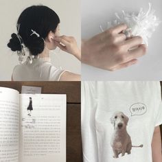 a woman is holding an open book and looking at the dog on her t - shirt