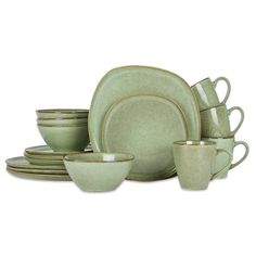 a green dinner set with cups and saucers