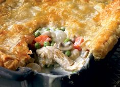 a chicken pot pie with peas and carrots