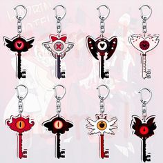 six keychains with different designs on them, each featuring an evil bird and eye