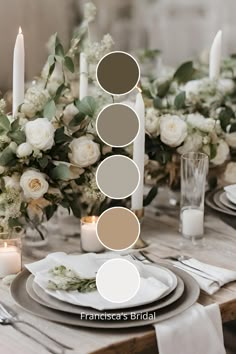 the table is set with white flowers, candles and place settings for an elegant dinner