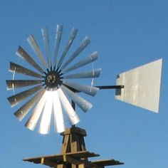 an old fashioned windmill on top of a building