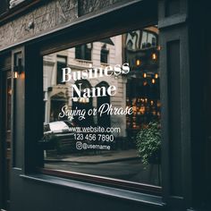 a business name is reflected in the window of a storefront on a city street