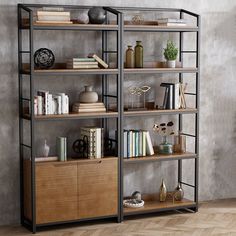 a bookshelf filled with lots of books on top of wooden shelves next to a wall