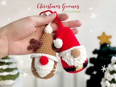 a hand holding an ornament that is made to look like santa claus's hat