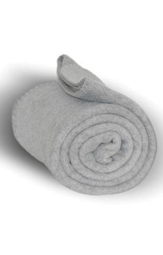 a rolled up blanket sitting on top of a white surface