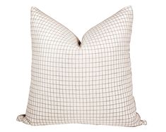 a white and brown plaid pillow on a white background with a black stripe down the middle