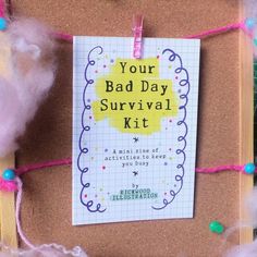 a bulletin board with a note attached to it that says your bad day survival kit