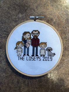 a cross - stitch family portrait with the text, the lostys 2019 on it