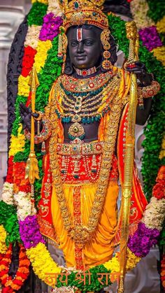 the statue of lord rama is surrounded by flowers