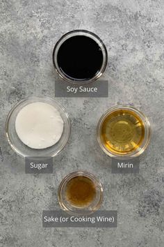 four different types of sauces in small bowls on a table with labels describing the ingredients