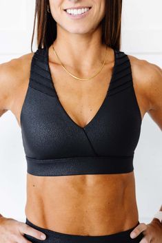 Introducing the Moto Sports Bra - this bad a$$ bra is crafted with faux leather fabric and features Moto Detailing throughout, adding an edgy touch to your workout ensemble. Designed with a flattering V neckline, this bra enhances your natural curves while offering a medium level of impact support. Whether you're lifting at the gym or tackling your favorite fitness class, you can count on this bra to provide the comfort and stability you need to confidently conquer your workout. Pair it with our Long Sleeve Outerwear, Tank Top Bras, Long Torso, Faux Leather Fabric, Natural Curves, Long Crop Top, Kids Swimming, Cheeky Bikinis, At The Gym